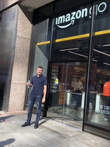 Image: Happy customer in front of Amazon Go shop in San Francisco